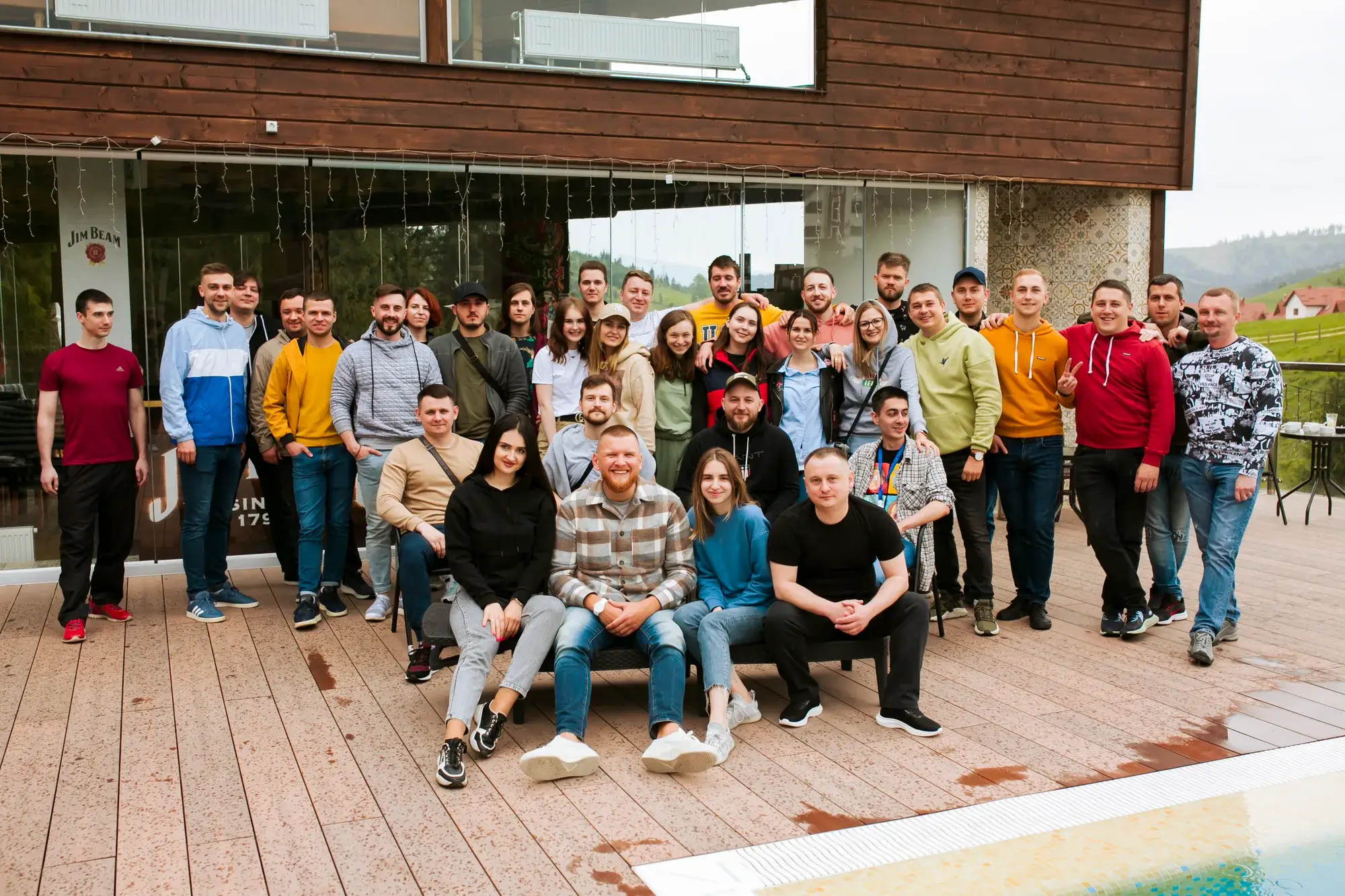 The ImproveIT team together on a terrace at a mountain retreat